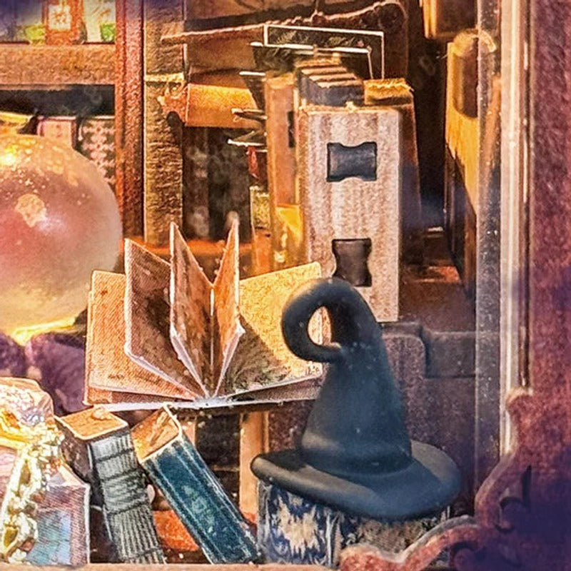 A crystal ball sits among spell books and keepsakes.