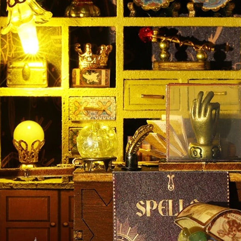 A gold-toned hand in a cabinet of curios.