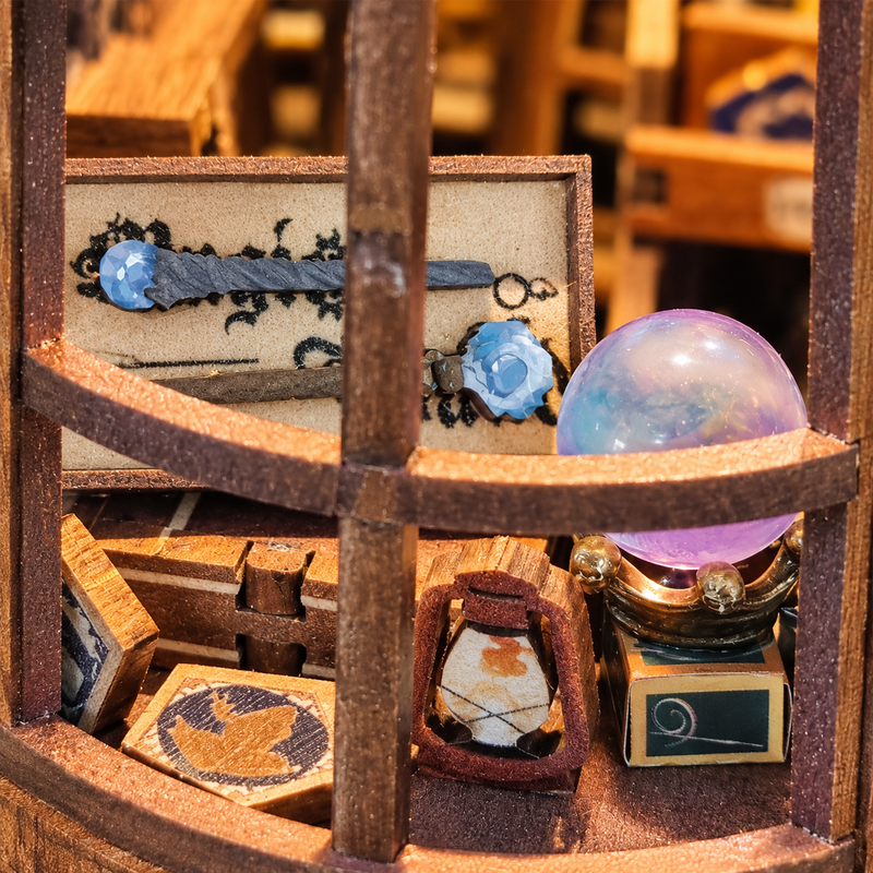 Blue-tipped wands and an iridescent sphere