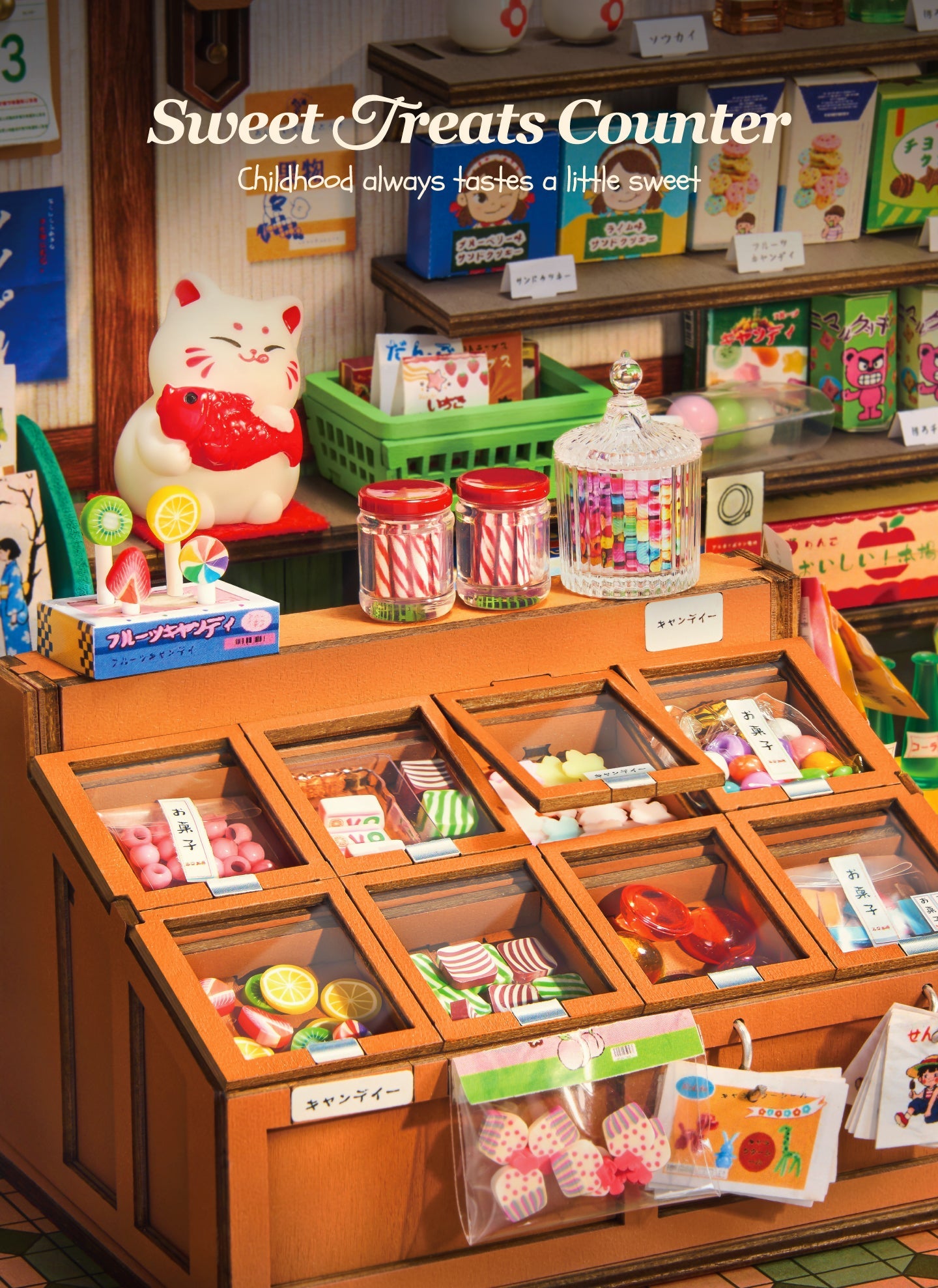 Miniature sweets counter with jars, lollipops, compartmented trays and a lucky cat