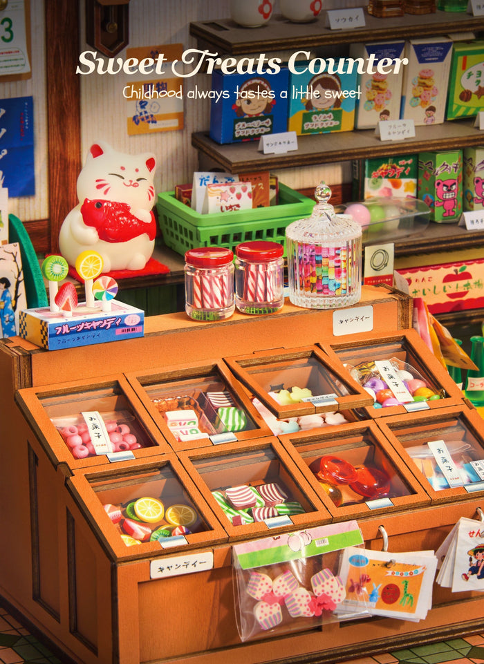Miniature sweets counter with jars, lollipops, compartmented trays and a lucky cat