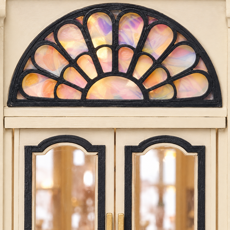 A fan-shaped window above the double doors.