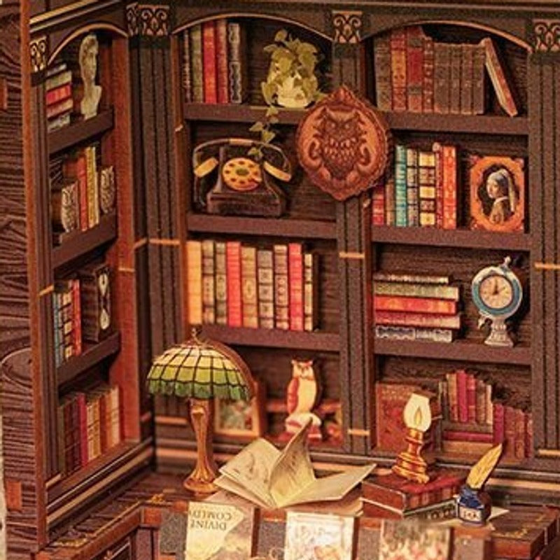 A vintage clock nestled among the books and pictures.