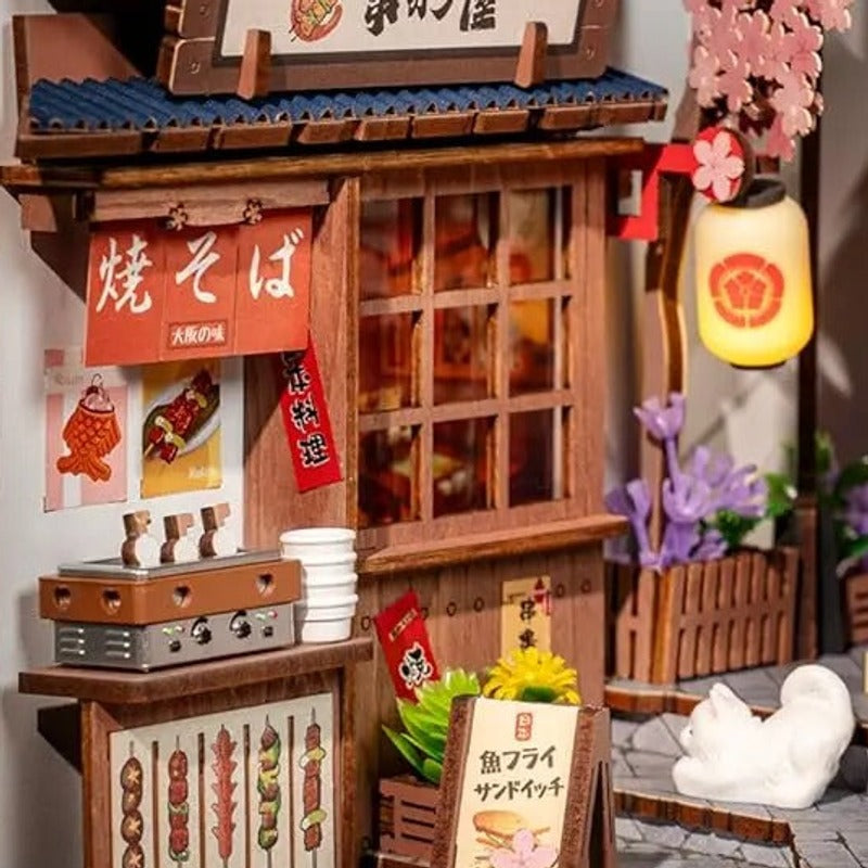 A tiny grill beneath the blossoms