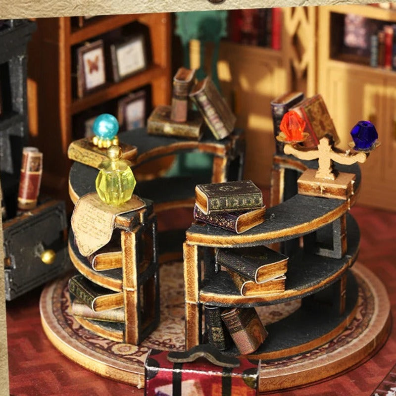 An upstairs counter arranged with books and curious bottles.